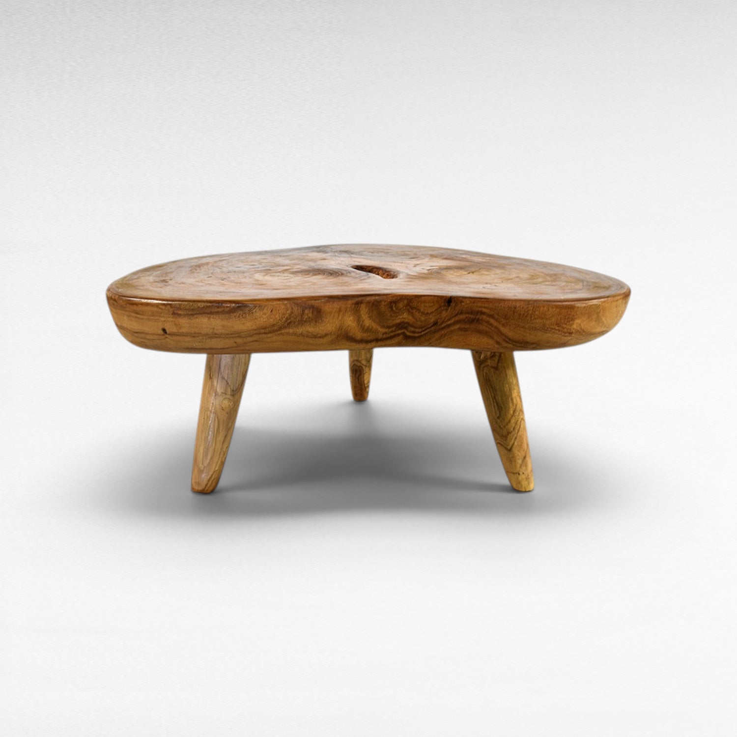 Chora Barefoot Luxury Living natural suar wood coffee table with organic grain and honey tones. Unique, solid wood construction.