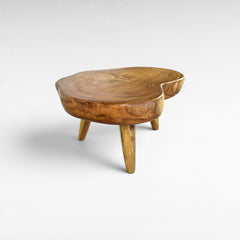 Chora Barefoot Luxury Living natural suar wood coffee table with organic grain patterns and honey tones. Unique, solid wood construction.