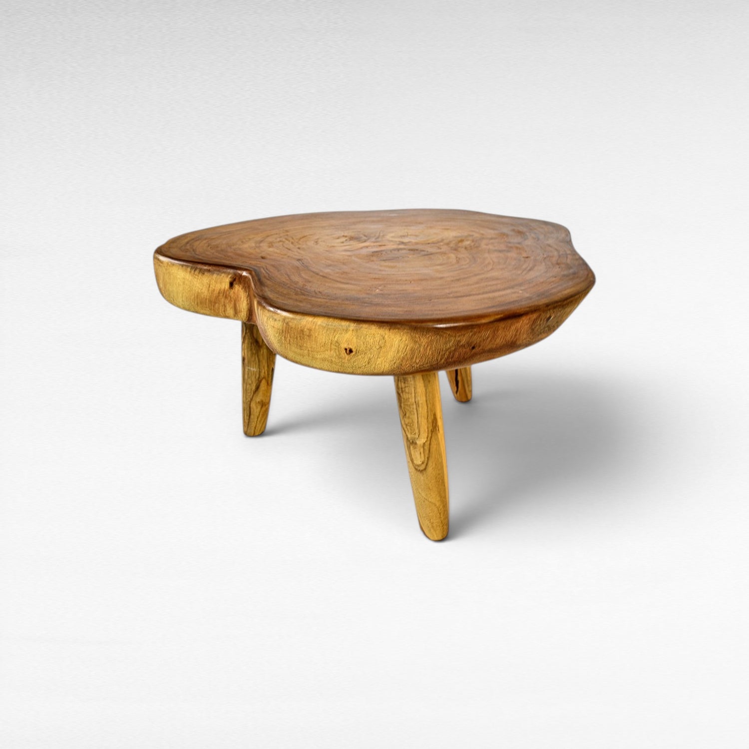 Chora Barefoot Luxury Living natural suar wood coffee table with organic grain patterns and honey tones. Unique, solid wood construction.