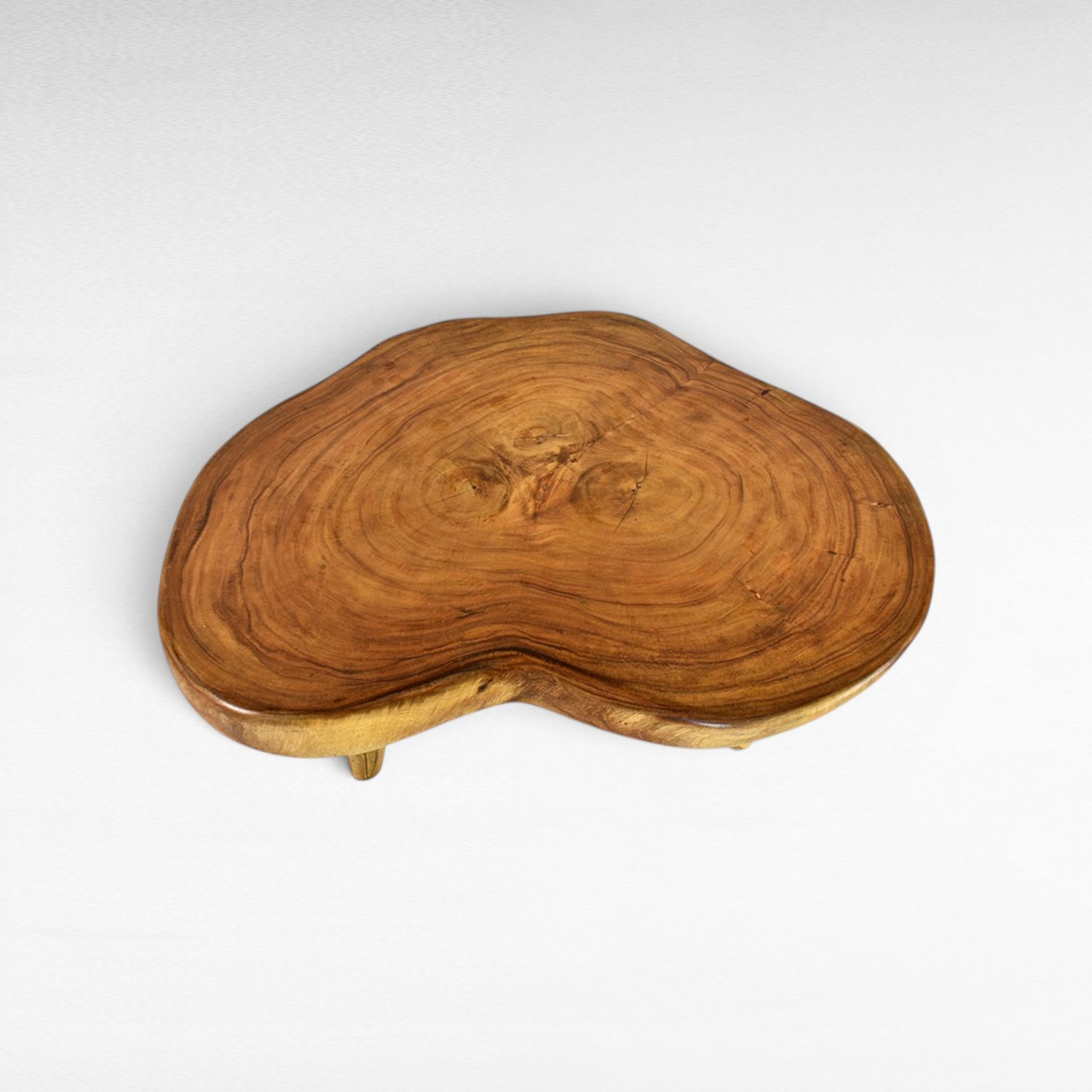 Chora Barefoot Luxury Living natural suar wood coffee table with organic grain patterns and honey tones. Unique, solid wood construction.