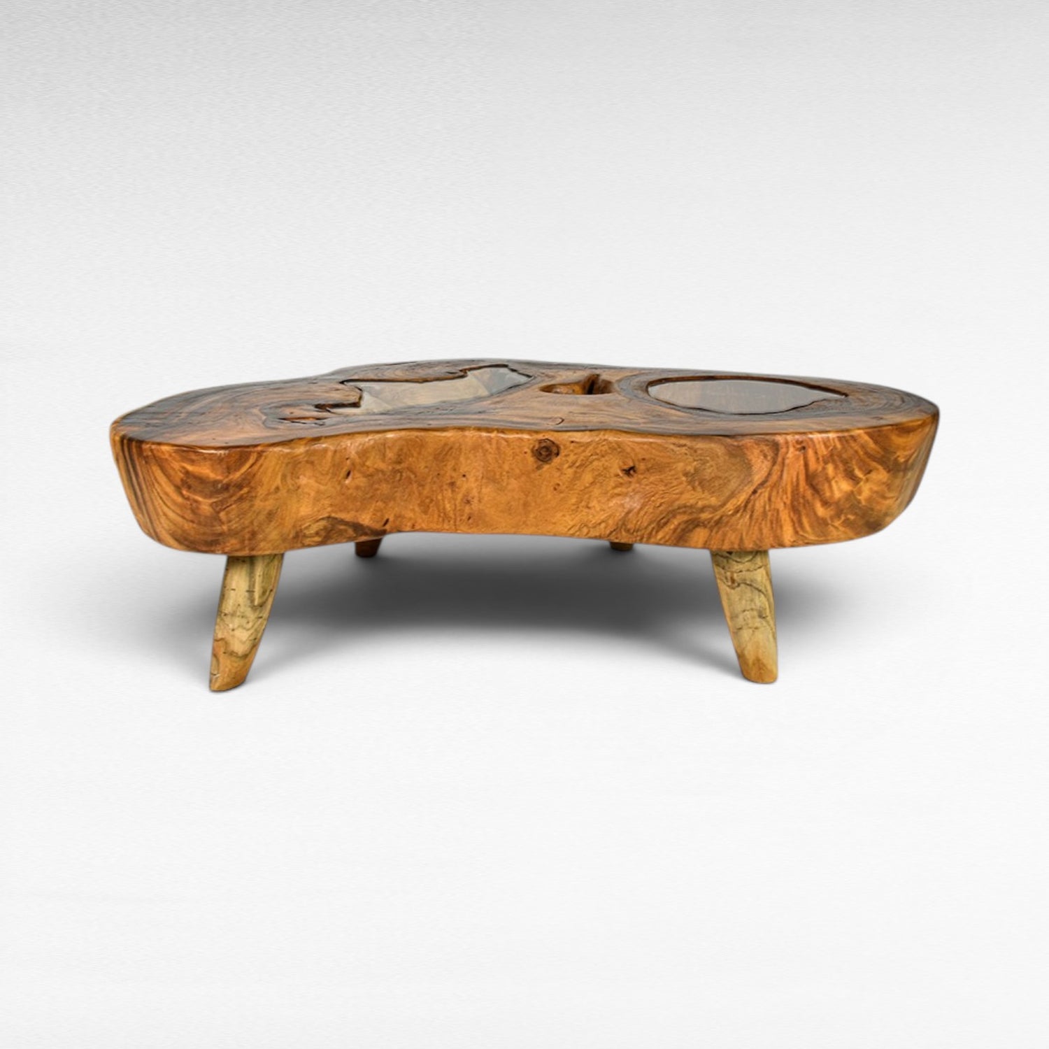 Chora Barefoot Luxury Living natural suar wood coffee table with glass inlays and unique live edge design.