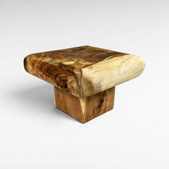 Chora Barefoot Luxury Living square suar wood coffee table with natural finish and unique grain patterns.