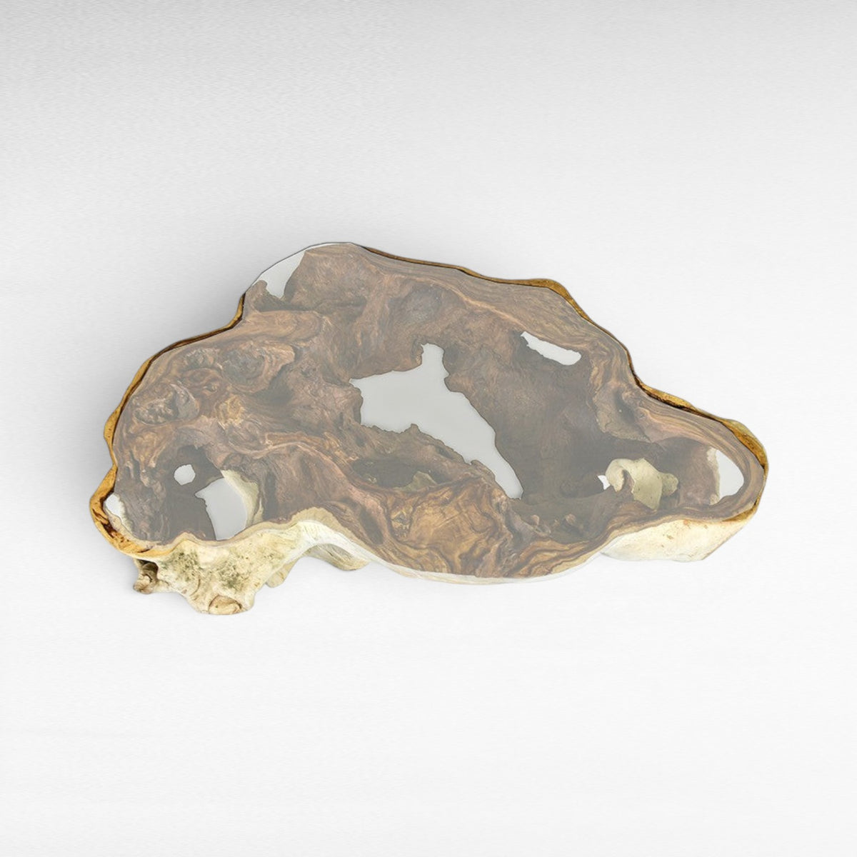 Chora Barefoot Luxury Living natural suar wood coffee table with unique organic shape and clear glass top.