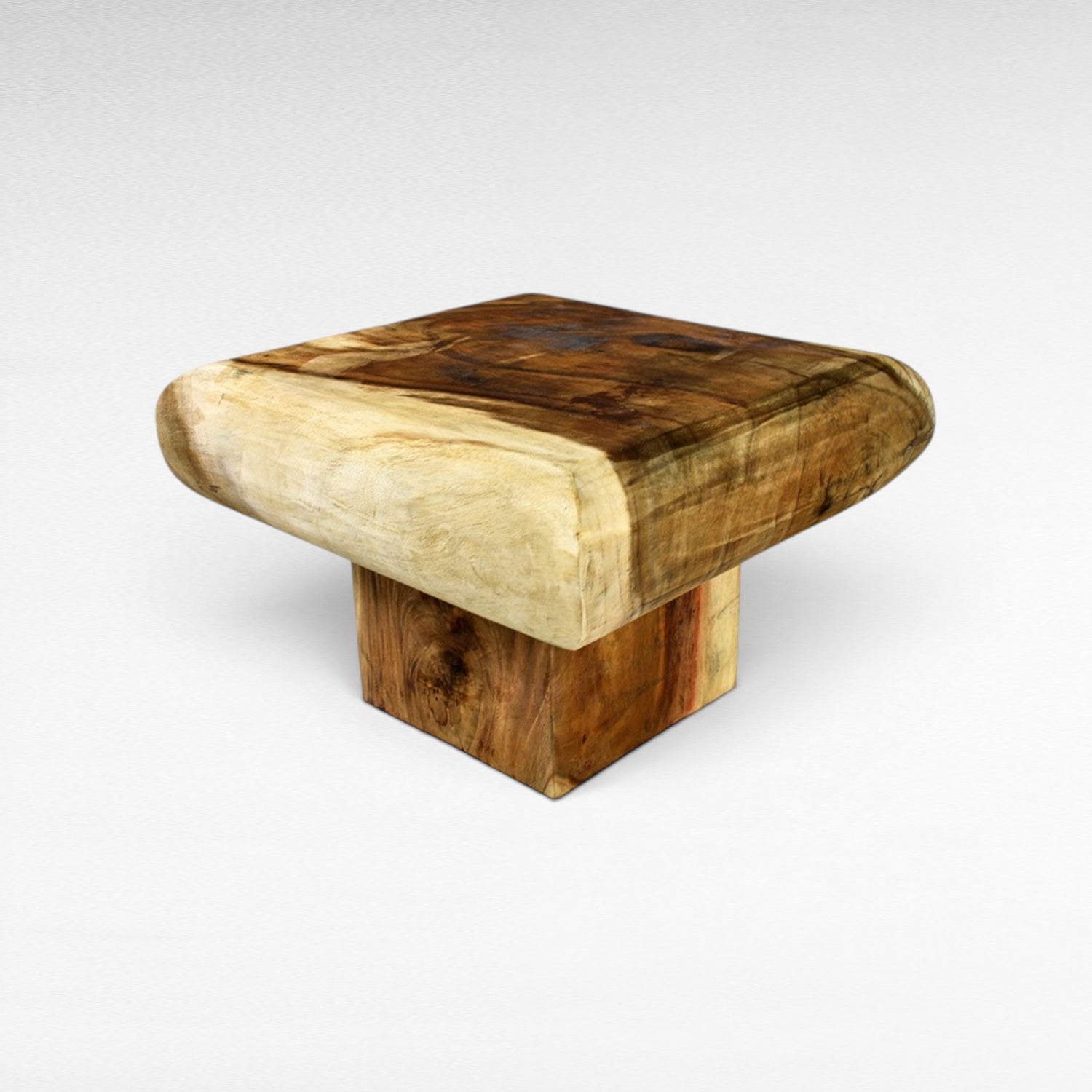 Chora Barefoot Luxury Living natural suar wood square coffee table with live edge detail and block base.