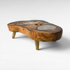 Chora Barefoot Luxury Living natural suar wood coffee table with clear resin inlays and tapered legs.