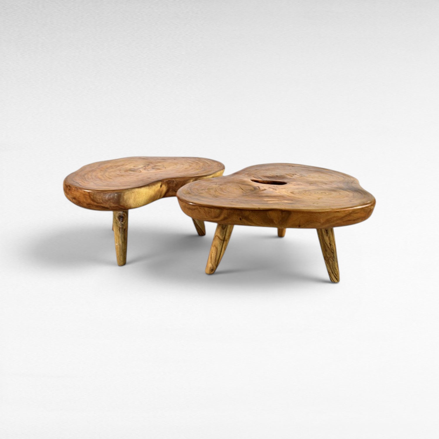 Chora Barefoot Luxury Living organic suar wood coffee table set with natural grain patterns and honey tones. Unique, solid wood construction.