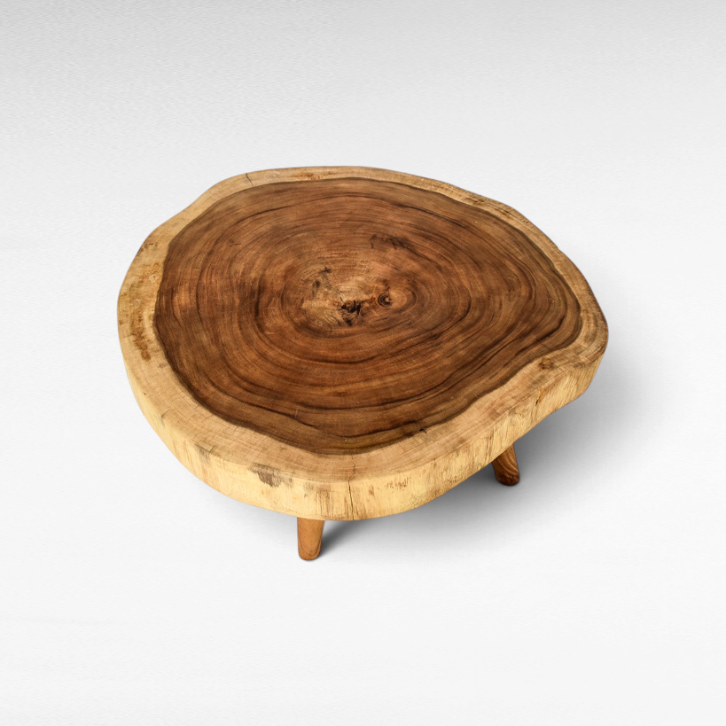 Chora Barefoot Luxury Living circular suar wood coffee table with natural live edge grain and three sturdy legs