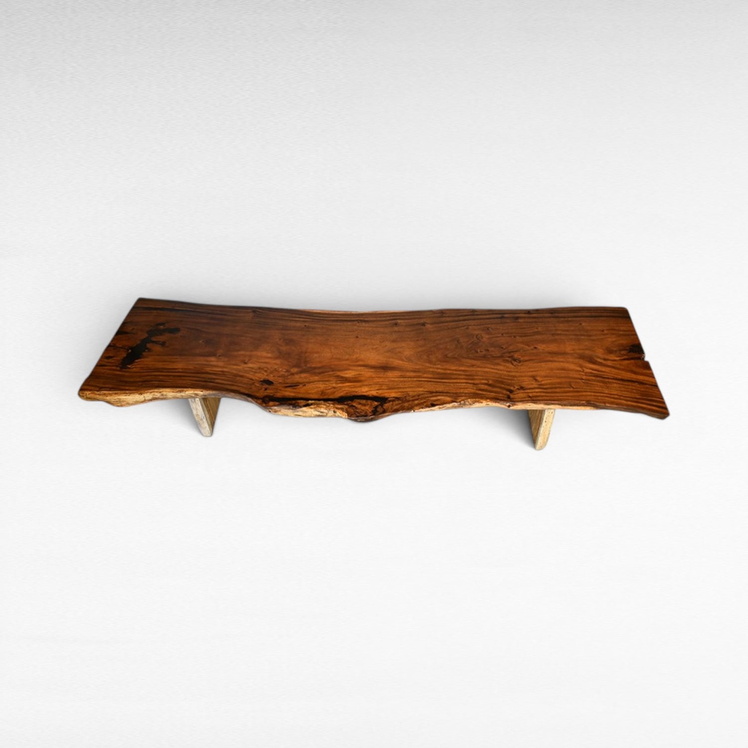 Chora Barefoot Luxury Living suar wood dining table with live edge, natural wood grain, and light stone legs. L510 D110 H80 cm.