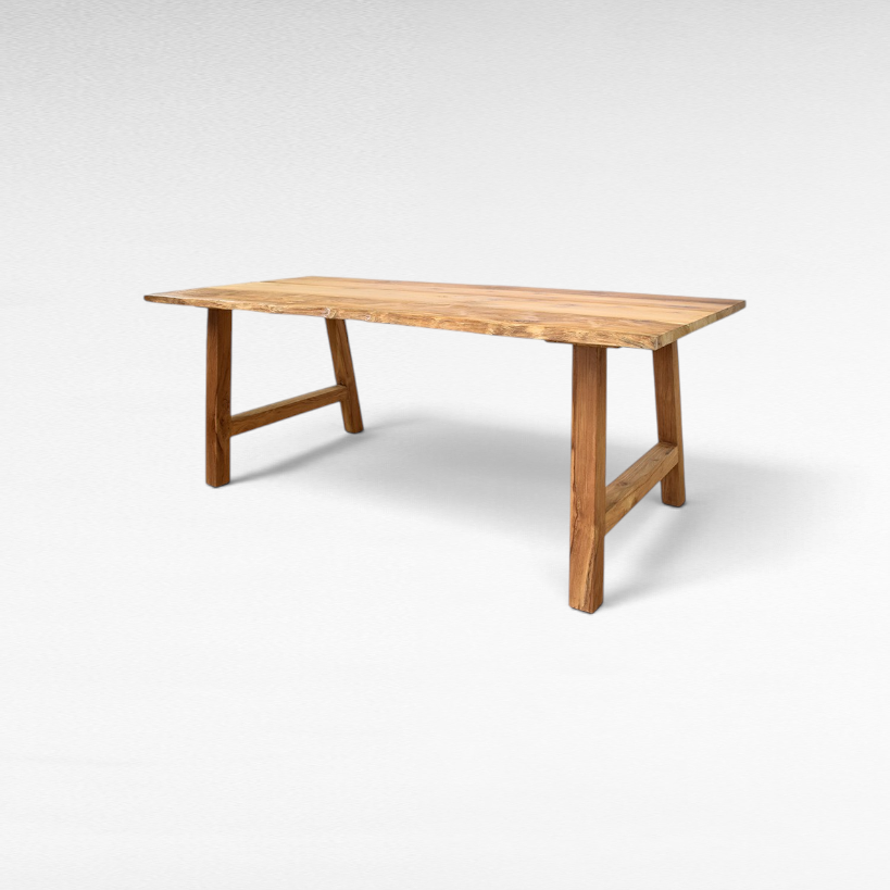 Chora Barefoot Luxury Living handcrafted suar wood dining table with natural live edge and sturdy trestle base