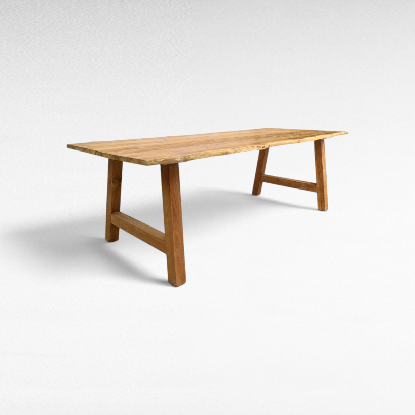Chora Barefoot Luxury Living handcrafted suar wood dining table with natural grain and organic live edges.