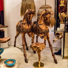 Chora Barefoot Luxury Living decorative land creature sculpture of two horses, crafted from natural and black Suar wood.