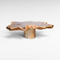 Chora Barefoot Luxury Living suar wood star shaped coffee table with natural live edge and unique wood grain.
