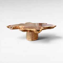 Chora Barefoot Luxury Living suar wood table with natural live edge and star shape. Features a unique pedestal base.