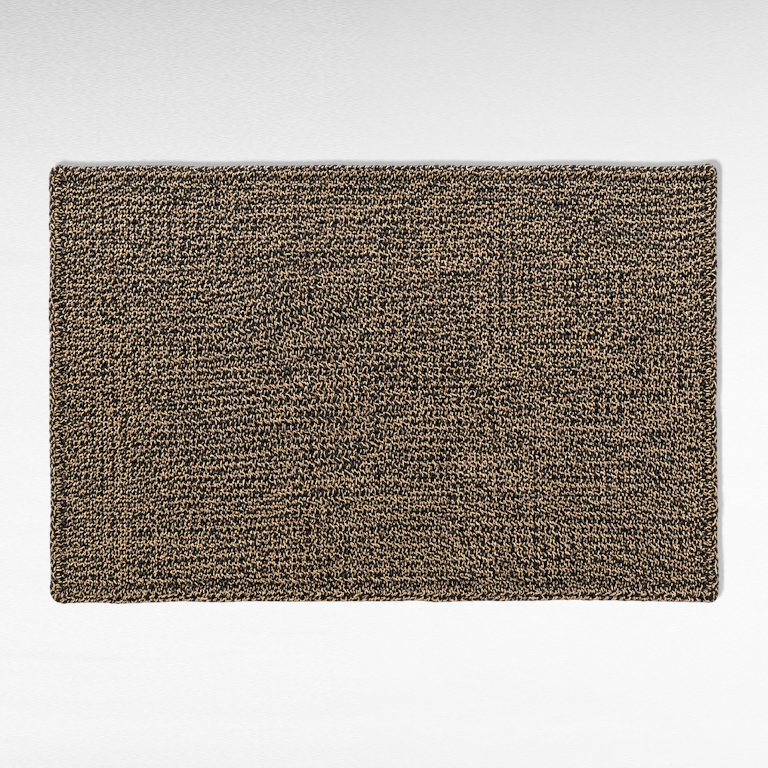 Chora Barefoot Luxury Living synthetic grass carpet in a textured natural and black woven pattern