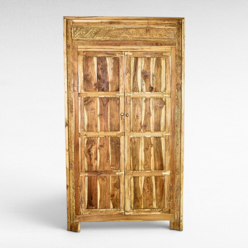 Chora Barefoot Luxury Living teak cabinet with carved details and paneled doors, W120 x D60 x H220 cm.