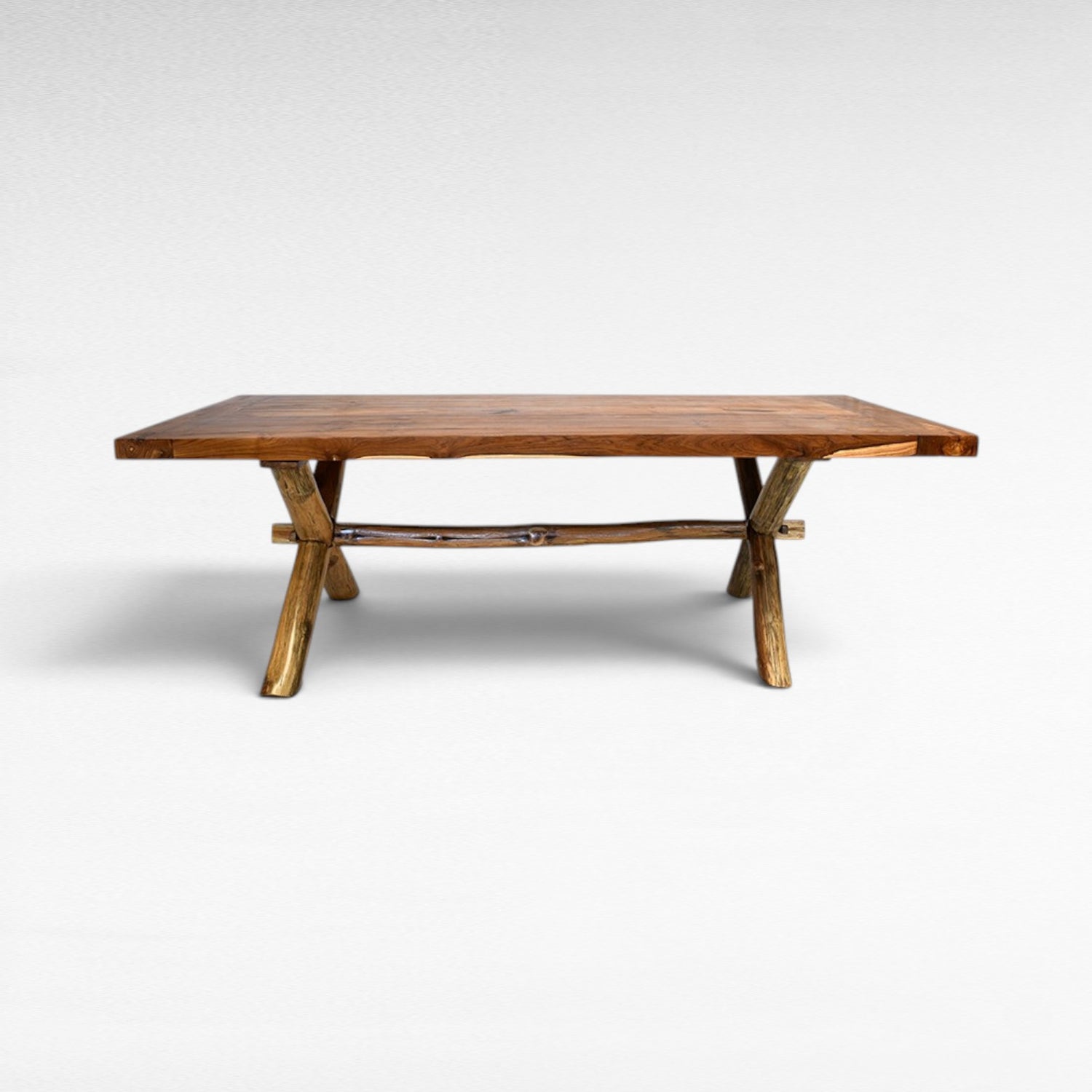 Chora Barefoot Luxury Living teak wood dining table with natural edge and rustic branch legs, 250cm W x 100cm D x 78cm H.