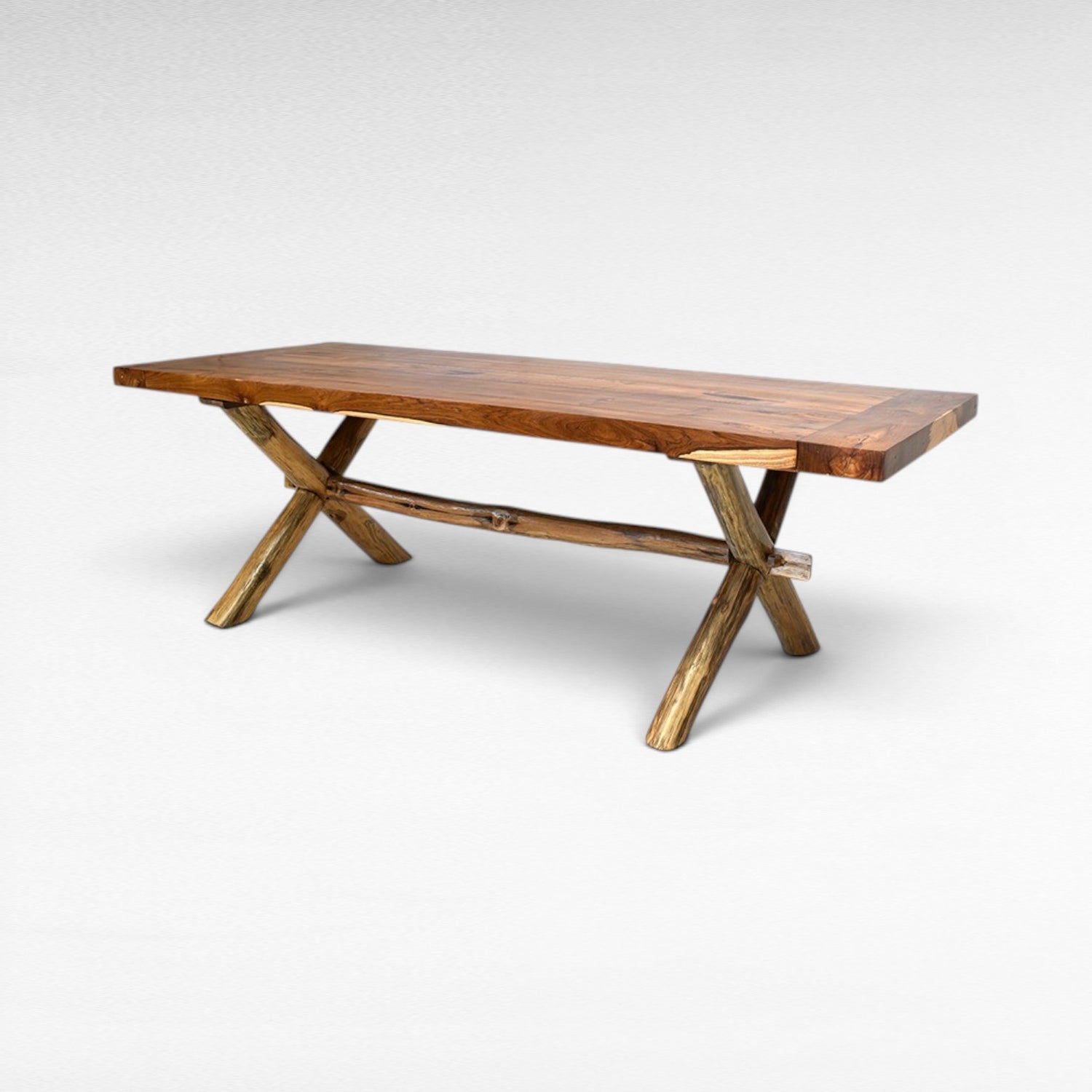 Chora Barefoot Luxury Living teak wood dining table with natural wood grain and rustic branch legs. Seats 6-8.
