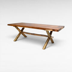 Chora Barefoot Luxury Living teak wood dining table with natural wood grain and rustic branch legs. Seats 6-8.