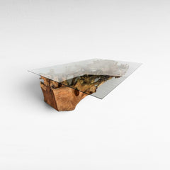 Chora Barefoot Luxury Living dining table with a natural teak wood root base and a rectangular clear glass top.