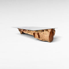 Chora Barefoot Luxury Living teak wood dining table with a clear glass top and natural organic wood base