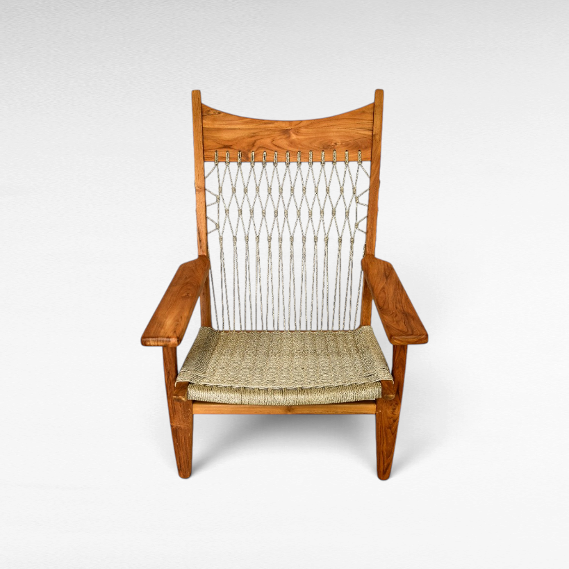 Chora Barefoot Luxury Living teak wood armchair with a woven synthetic raffia seat and decorative knotted backrest.