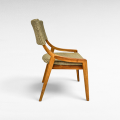 Chora Barefoot Luxury Living teak wood chair with woven synthetic rattan seat and backrest in a side profile view.