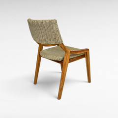 Chora Barefoot Luxury Living teak wood chair with woven synthetic rattan seat and backrest in a natural finish