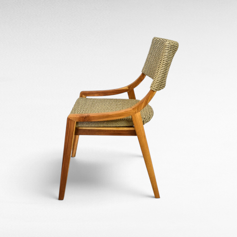 Chora Barefoot Luxury Living teak wood chair with woven synthetic rattan seat and backrest in a side profile view.