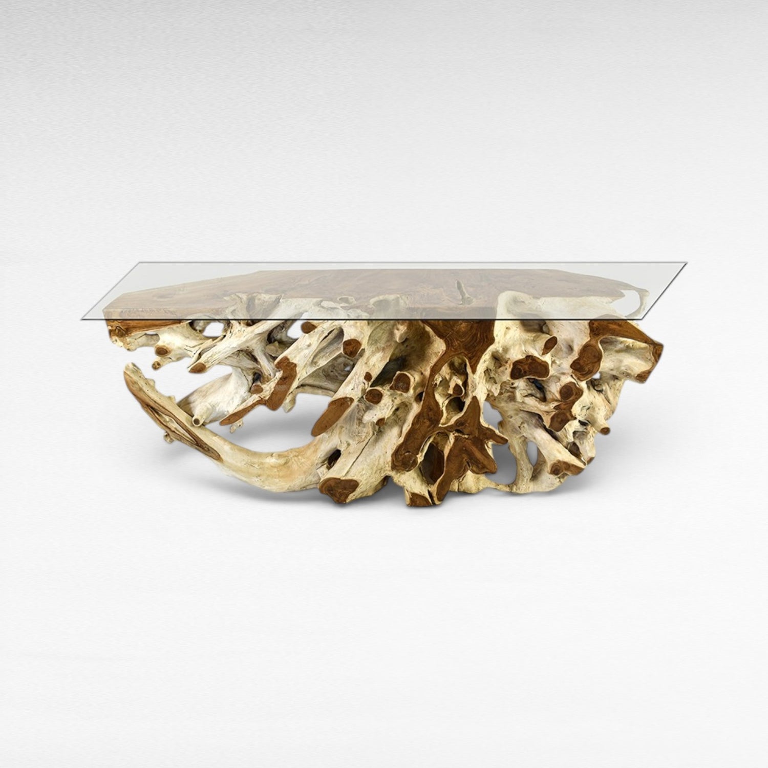 Chora Barefoot Luxury Living console table with a clear glass top and a natural teak root base. Unique organic design.