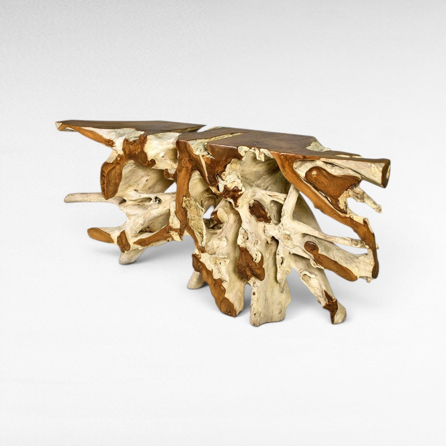 Chora Barefoot Luxury Living console table made from natural teak wood root, featuring a live edge top and intricate base.