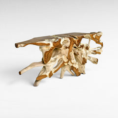 Chora Barefoot Luxury Living natural teak root console table with a live edge top, showcasing organic shapes and a blend of light and dark wood tones.