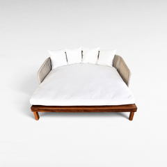 Chora Barefoot Luxury Living double outdoor lounger with teak wood base, woven rope sides, and white mattress cushions.