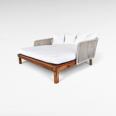 Chora Barefoot Luxury Living double size outdoor lounger with teak wood base, rope sides, and white mattress cushions.