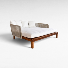 Chora Barefoot Luxury Living double size outdoor lounger with teak wood frame, woven rope sides, and white cushions.