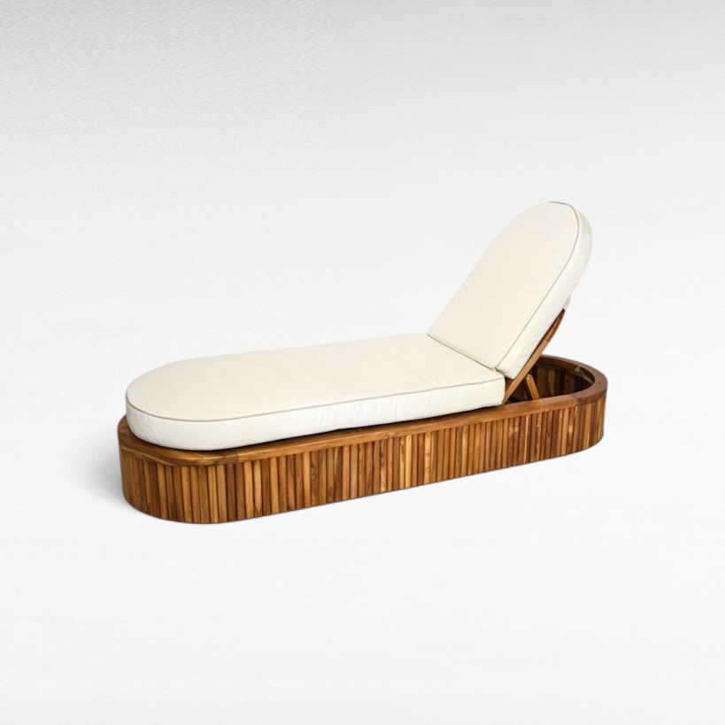 Chora Barefoot Luxury Living oval teak wood sunbed with a plush white cushion for outdoor relaxation.