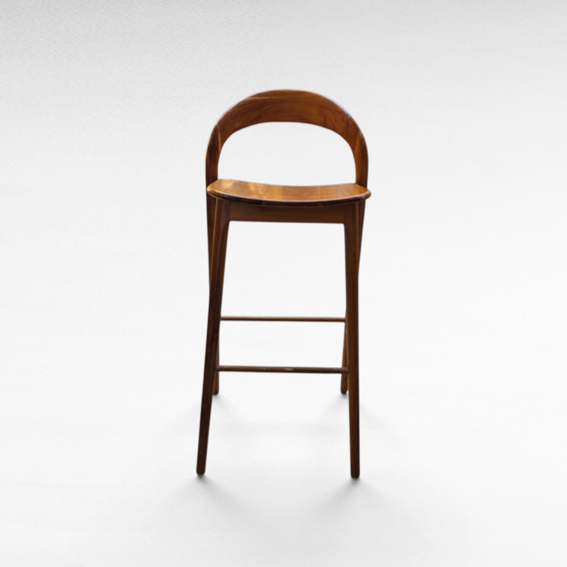 Chora Barefoot Luxury Living teak wood bar stool with a curved backrest and minimalist design on a white background.