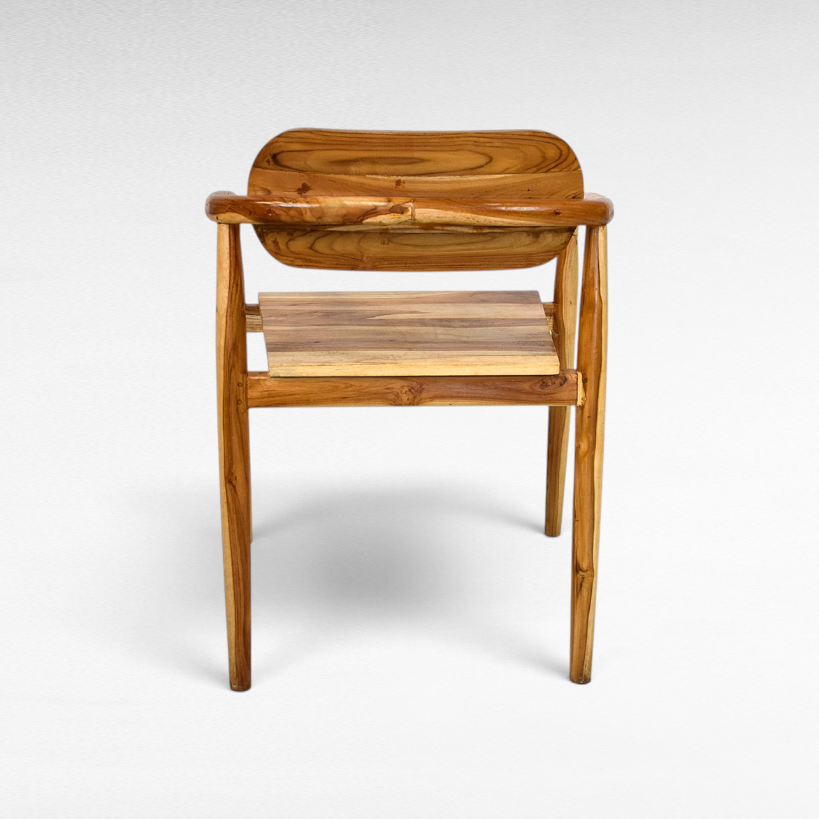 Chora Barefoot Luxury Living handcrafted teak wood chair with natural grain and warm honey tones, back view.