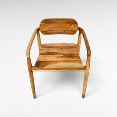 Chora Barefoot Luxury Living handcrafted teak wood dining chair with natural grain and warm honey tones