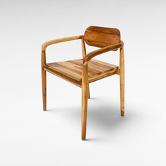 Chora Barefoot Luxury Living handcrafted teak wood chair with natural grain and warm honey tones