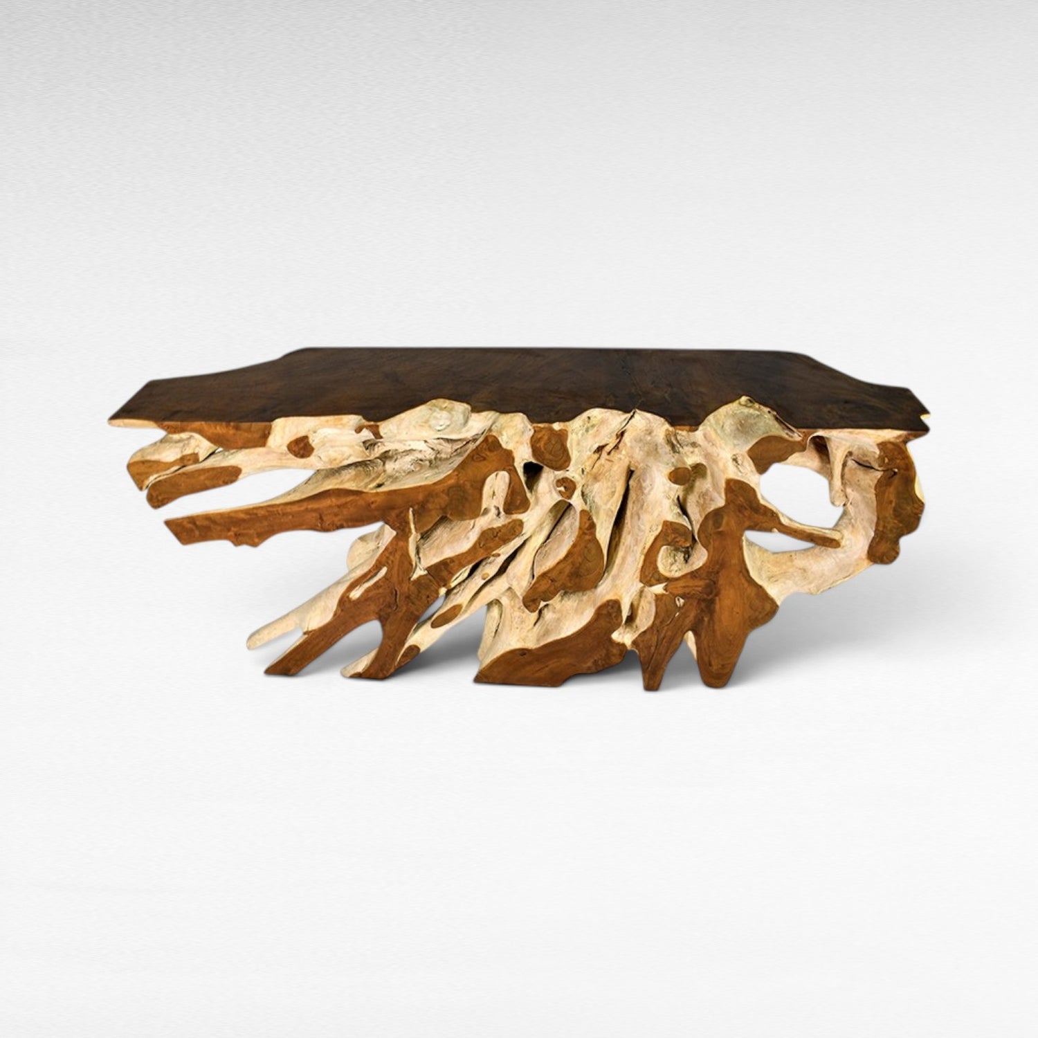 Chora Barefoot Luxury Living teak wood console table with bleached and natural root base and dark wood top.