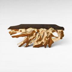 Chora Barefoot Luxury Living teak wood console table with bleached and natural root base and dark wood top.