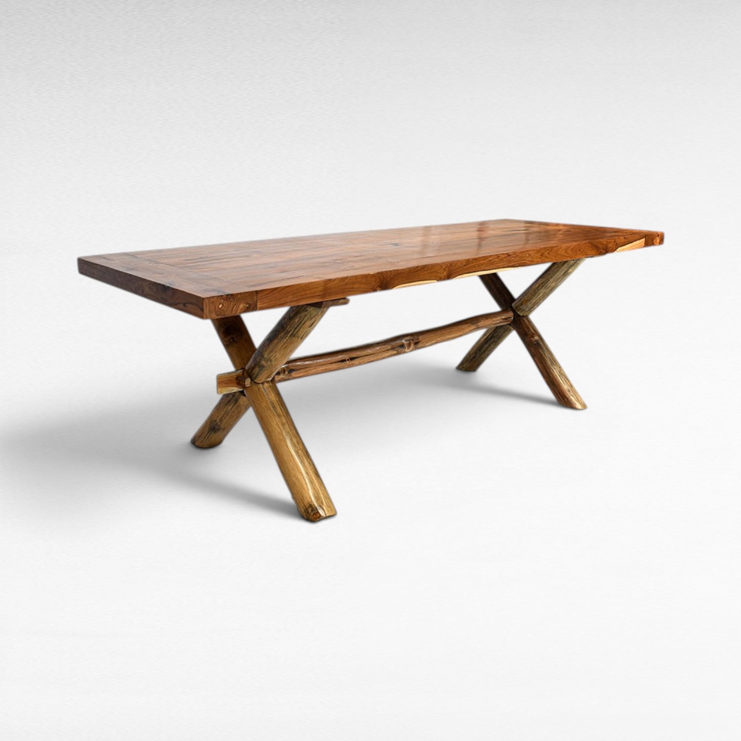 Chora Barefoot Luxury Living rustic teak wood dining table with natural edge and X-shaped log base. W250 D100 H78 cm.