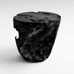 Chora Barefoot Luxury Living natural teak wood stool with a rustic, carved design and a dark brown finish.