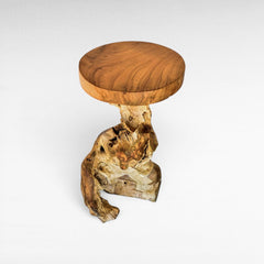 Chora Barefoot Luxury Living natural teak wood stool with a smooth round top and organic root base