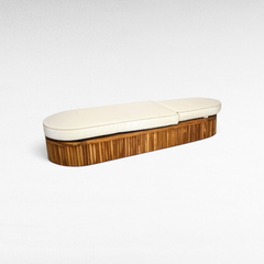 Chora Barefoot Luxury Living oval teak wood sunbed with a plush white cushion for outdoor relaxation.