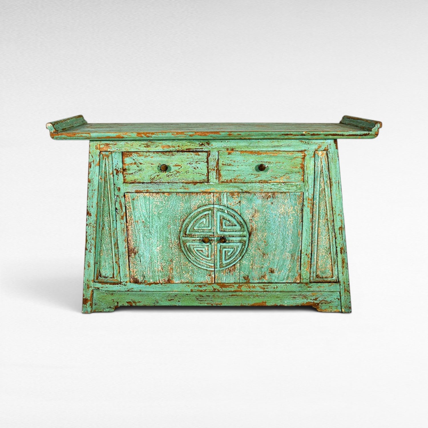 Chora Barefoot Luxury Living distressed teal buffet with two drawers and carved circular motif on doors.
