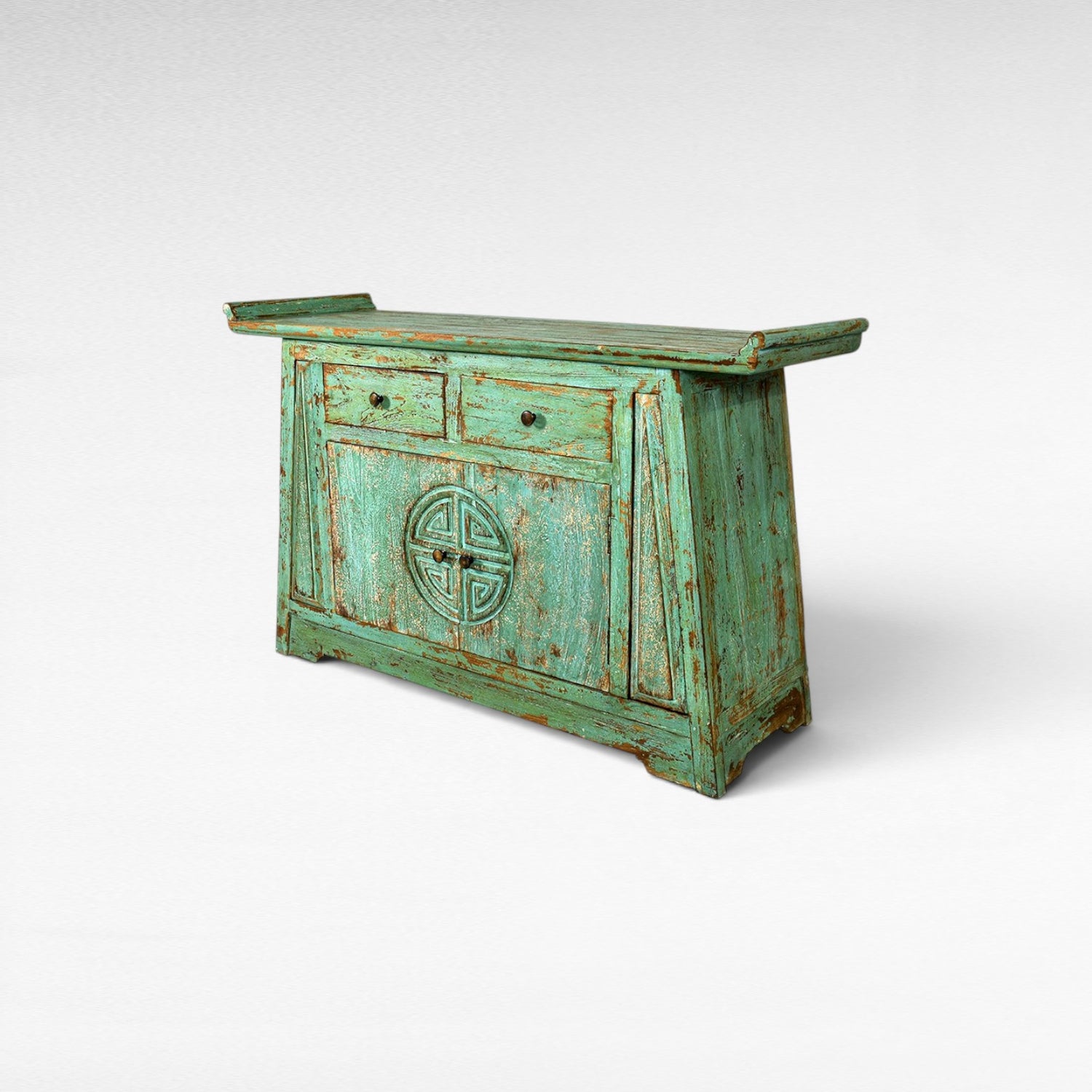 Chora Barefoot Luxury Living distressed teal wooden buffet with two drawers and carved circular motif on doors.