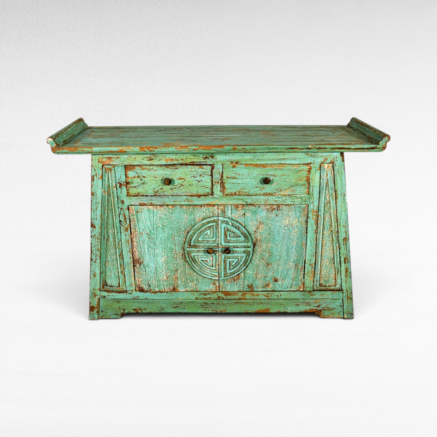 Chora Barefoot Luxury Living distressed teal wooden cabinet with two drawers and double doors featuring a carved circular motif.