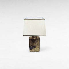 Chora Barefoot Luxury Living gold and black tiger print table lamp with cream shade.