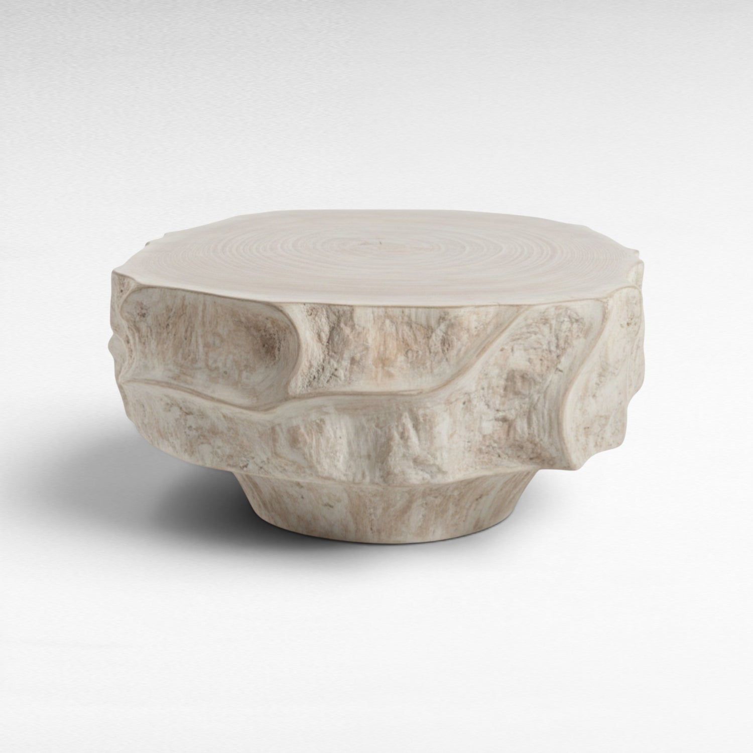 Chora Barefoot Luxury Living light wood tree stump coffee table with natural bark texture and wood grain top.